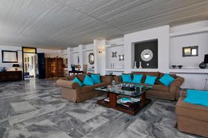 a large living room with couches and a table at Mare Vista Hotel - Epaminondas in Batsi