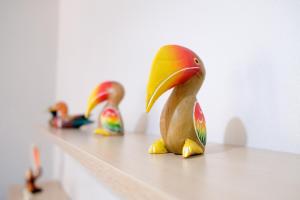 a row of rubber ducks sitting on top of a counter at 7 Rooms Kohchang in Ko Chang