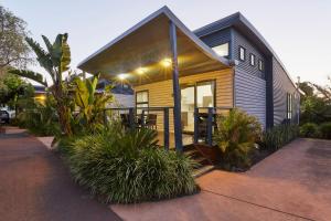 a small house with a porch and some plants at BIG4 Breeze Holiday Parks - Busselton in Busselton