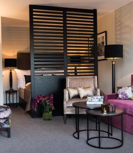 Saga Apartments Oslo tesisinde bir odada yatak veya yataklar