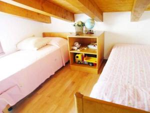 A bed or beds in a room at Alessia