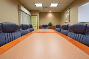 a conference room with a long table and chairs at Country Inn & Suites by Radisson, Hagerstown, MD in Hagerstown +183 photos