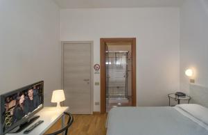 Postel nebo postele na pokoji v ubytování Hotel Cecile