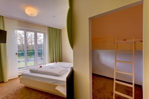 Ein Bett oder Betten in einem Zimmer der Unterkunft Pension Sonnengarten & Therme included - auch am An- & Abreisetag!