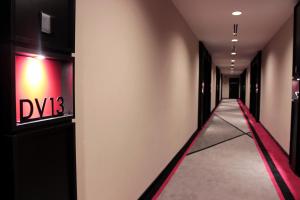 a hallway with a stairway leading to a stairway at the RED One KLCC in Kuala Lumpur