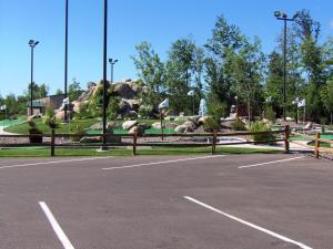 a parking lot with a park with a fountain at The Lodge at Crooked Lake in Siren