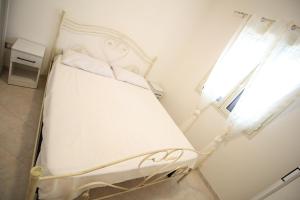 En eller flere senge i et værelse på Bilocale Savonarola