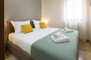 Postel nebo postele na pokoji v ubytování Prime Hotel Apartmani