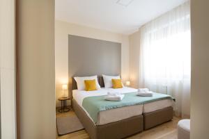 Postel nebo postele na pokoji v ubytování Prime Hotel Apartmani