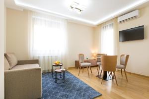 TV a/nebo společenská místnost v ubytování Prime Hotel Apartmani