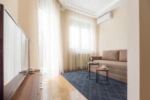 TV a/nebo společenská místnost v ubytování Prime Hotel Apartmani