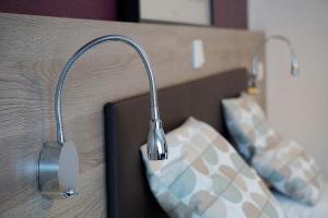 Postel nebo postele na pokoji v ubytování Hotel Kramer