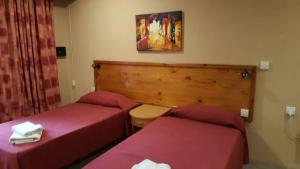 Postel nebo postele na pokoji v ubytování Alborada Apart Hotel