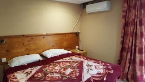 Postel nebo postele na pokoji v ubytování Alborada Apart Hotel