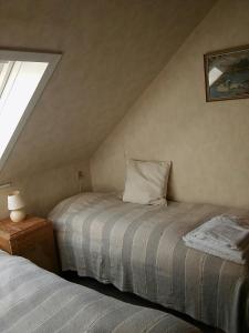 Postel nebo postele na pokoji v ubytování Aadal Apartment