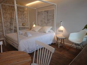 Postel nebo postele na pokoji v ubytování Hotel San Nikolas Sea Views + 21 fotografií