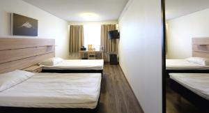 Postel nebo postele na pokoji v ubytování Finlandia Hotel Airport Oulu