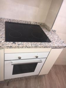 Kuchyň nebo kuchyňský kout v ubytování Apartamento el Torreón