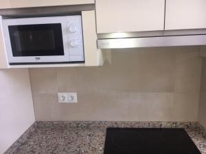 Kuchyň nebo kuchyňský kout v ubytování Apartamento el Torreón