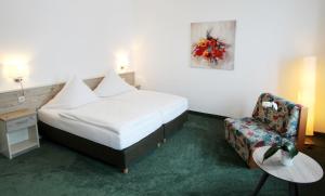 Postel nebo postele na pokoji v ubytování Hotel Thormählen