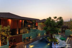 an aerial view of a house with a swimming pool at At Leaf Villa in Chiang Mai