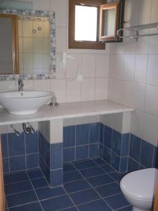 a bathroom with a sink and a toilet at Megalos Mourtias in Alonnisos