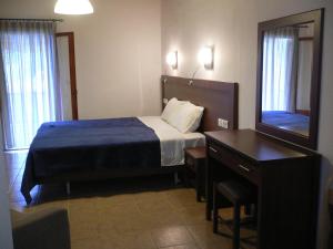 Ένα ή περισσότερα κρεβάτια σε δωμάτιο στο Megalos Mourtias