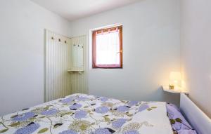 Postel nebo postele na pokoji v ubytování Apartments Jadranovo