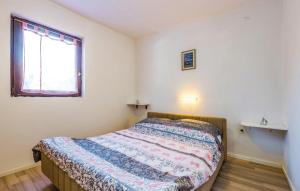 Postel nebo postele na pokoji v ubytování Apartments Jadranovo