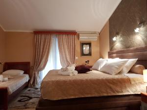 Postel nebo postele na pokoji v ubytování Apartments Bogdanovic + 37 fotografií