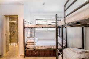 Ein Bett oder Betten in einem Zimmer der Unterkunft Hostel A2C