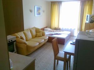 a living room with a couch and a table at SB Rentals Apartments in Royal Dreams Complex in Sunny Beach