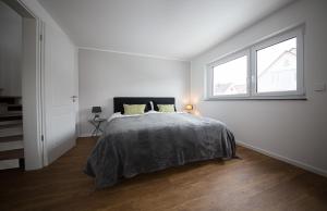 Ένα ή περισσότερα κρεβάτια σε δωμάτιο στο Ferienhaus Albert