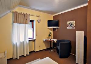 TV a/nebo společenská místnost v ubytování Hotel Kattenbeck