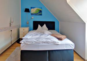 Postel nebo postele na pokoji v ubytování Hotel Kattenbeck