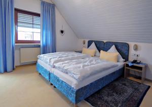 Postel nebo postele na pokoji v ubytování Hotel Kattenbeck