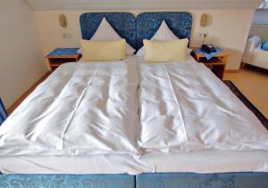 Postel nebo postele na pokoji v ubytování Hotel Kattenbeck