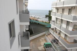 a view of the ocean from a balcony of a building at Vista Mare Rivabella in Gallipoli