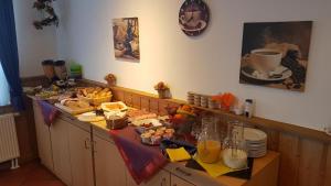 a kitchen filled with lots of different types of food at Hotel Waldhaus in Römhild