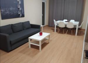 a living room with a couch and a table at Zamora Apartments in Zamora