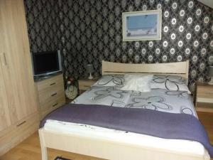 Posteľ alebo postele v izbe v ubytovaní Kaiser Apartman