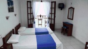Postel nebo postele na pokoji v ubytování Hotel Selenunda