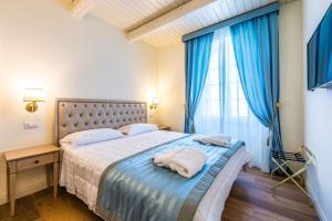 Postel nebo postele na pokoji v ubytování Relais Paradiso Resort & Spa