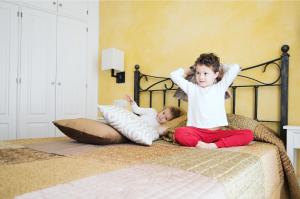 Postel nebo postele na pokoji v ubytování La Casa dels Abeuradors