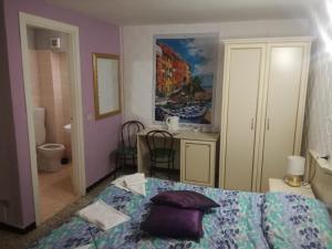 Postel nebo postele na pokoji v ubytování Hotel La Zorza