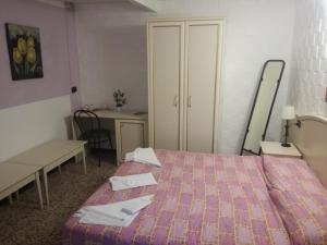 Postel nebo postele na pokoji v ubytování Hotel La Zorza
