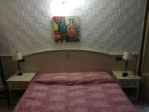 Postel nebo postele na pokoji v ubytování Hotel La Zorza