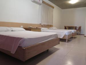מיטה או מיטות בחדר ב-Hotel Ideal