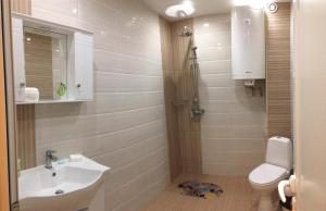 a bathroom with a sink and a toilet at Apartments Park Place in Sandanski