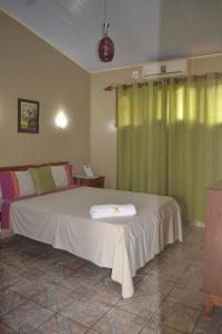 A bed or beds in a room at Estrella del Norte Hotel - Cobija